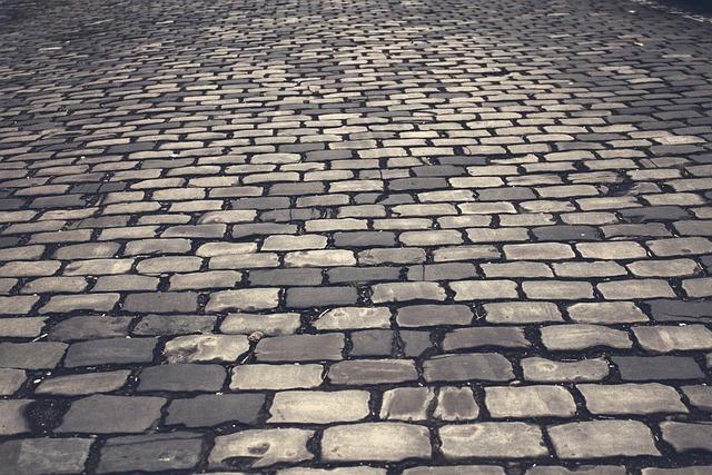 A close view of a well-used cobbled street